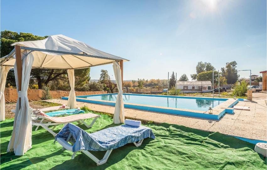 Amazing home in Sanlucar La Mayor with WiFi, 3 Bedrooms and Outdoor swimming pool