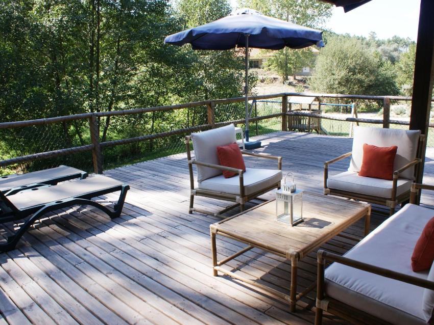 Detached house with a large porch, playground and pool