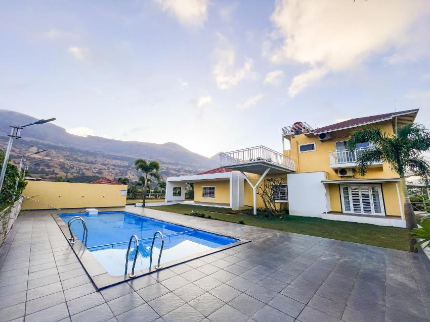 SaffronStays Lakehouse Springs, Nashik - lakefront luxury villa with chic interiors and panoramic mountain views