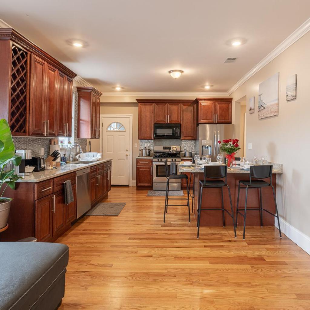 Photograph of Vibrant 4BR Boston Apt - Balcony, Bathtub, TV near I-95 & Pet Friendly 903
