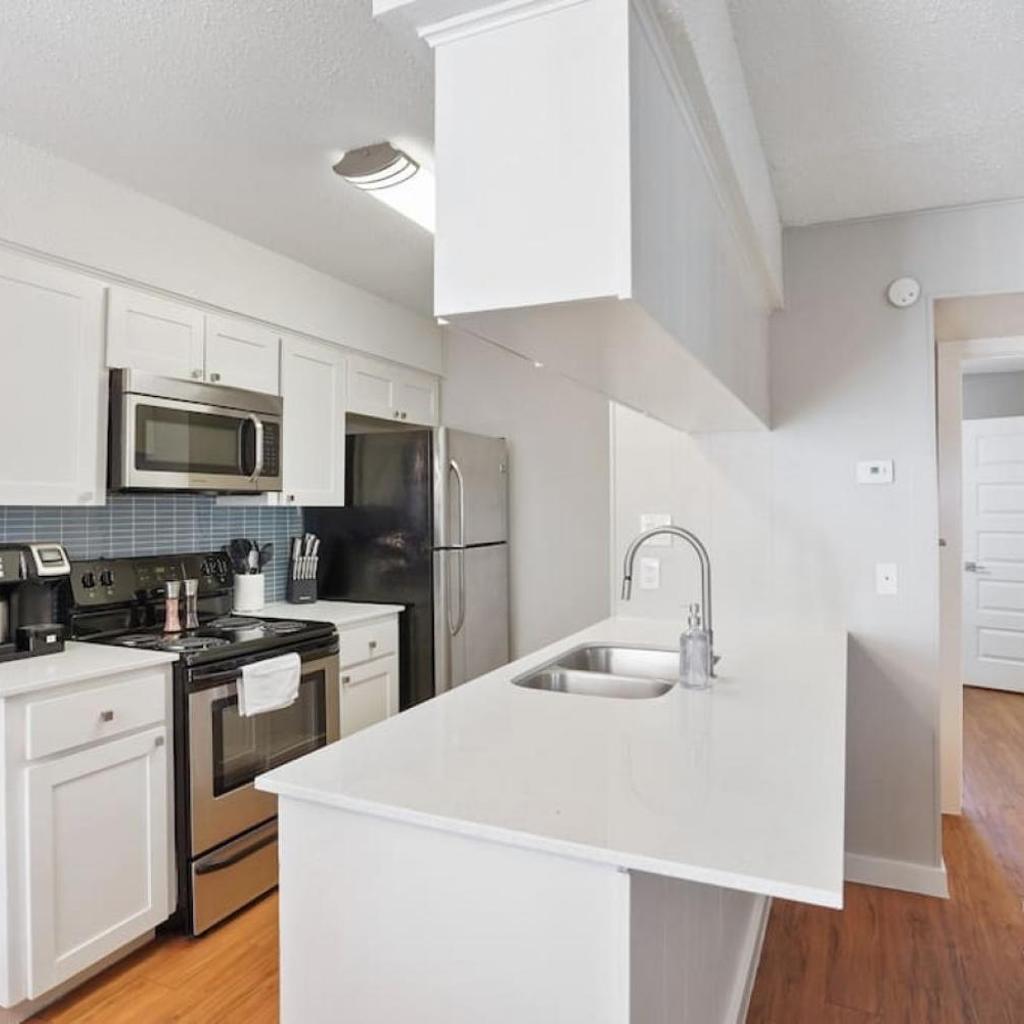 Photograph of Cook and Gather Around in a Fully Equipped Apartment