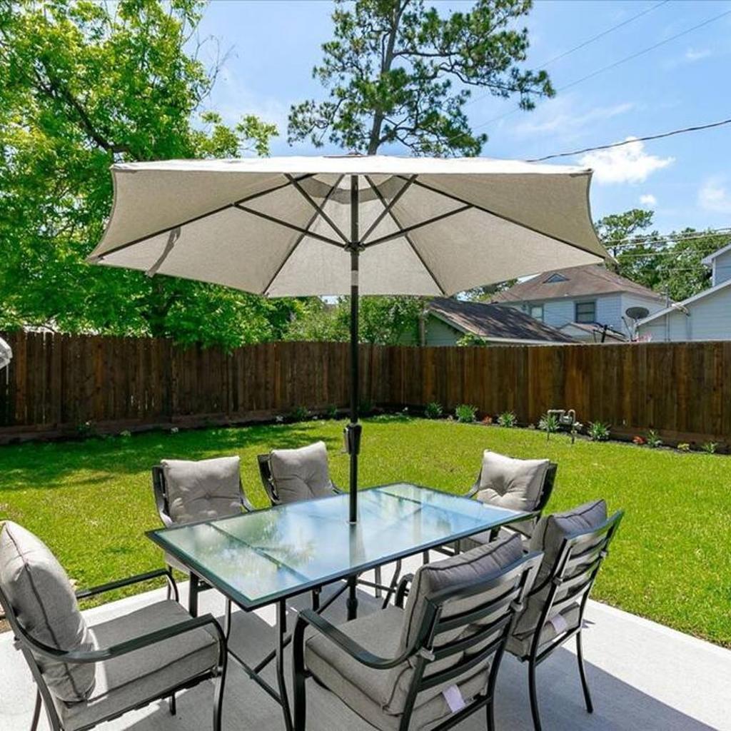 Photograph of Bring the Crew! 4BR Luxe Pad, Backyard Magic & City at Your Door