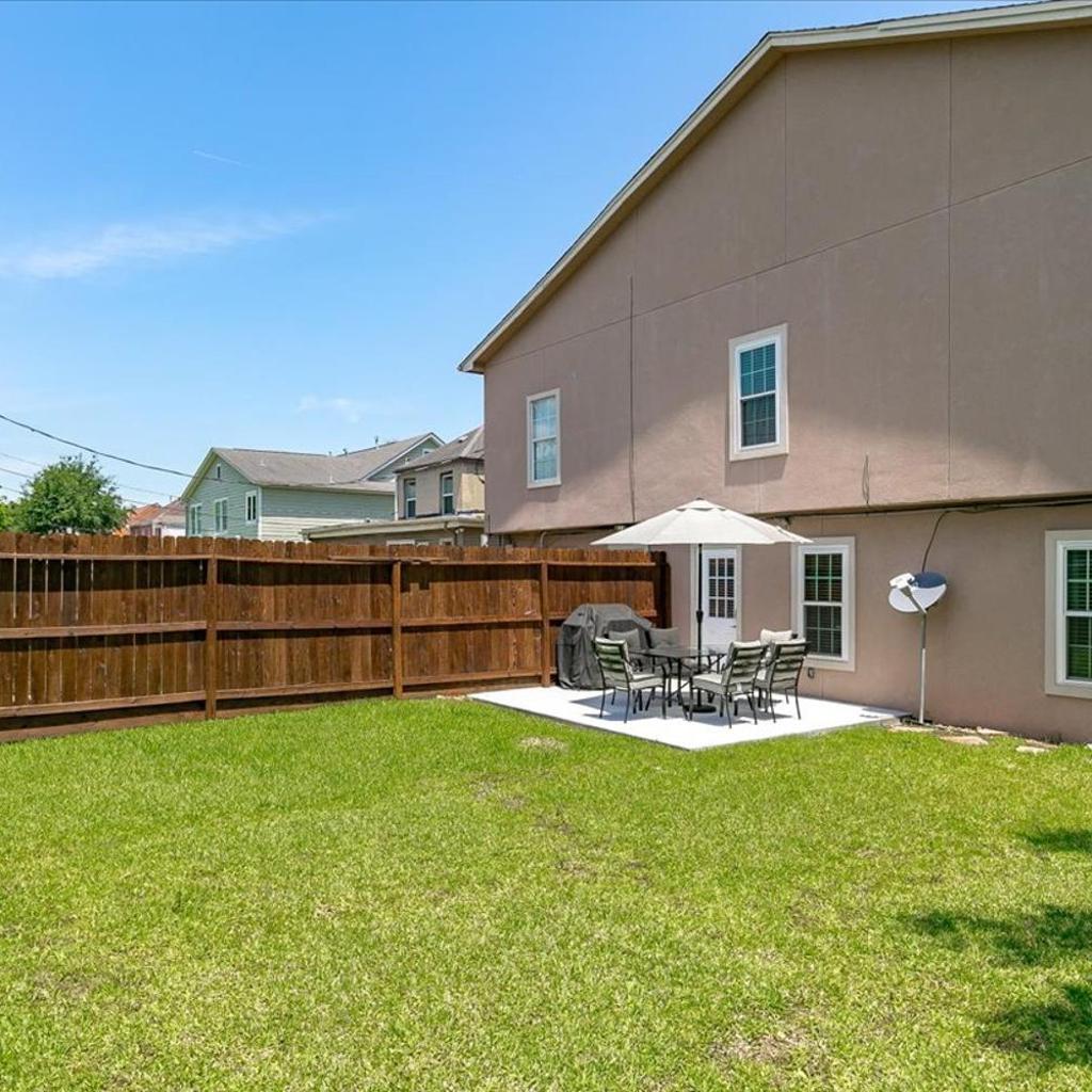 Photograph of Bring the Crew! 4BR Luxe Pad, Backyard Magic & City at Your Door