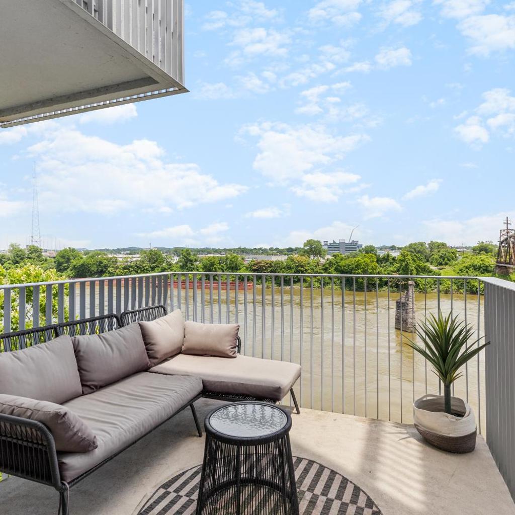 Photograph of River View High-End Condo with Private Patio and FREE Parking