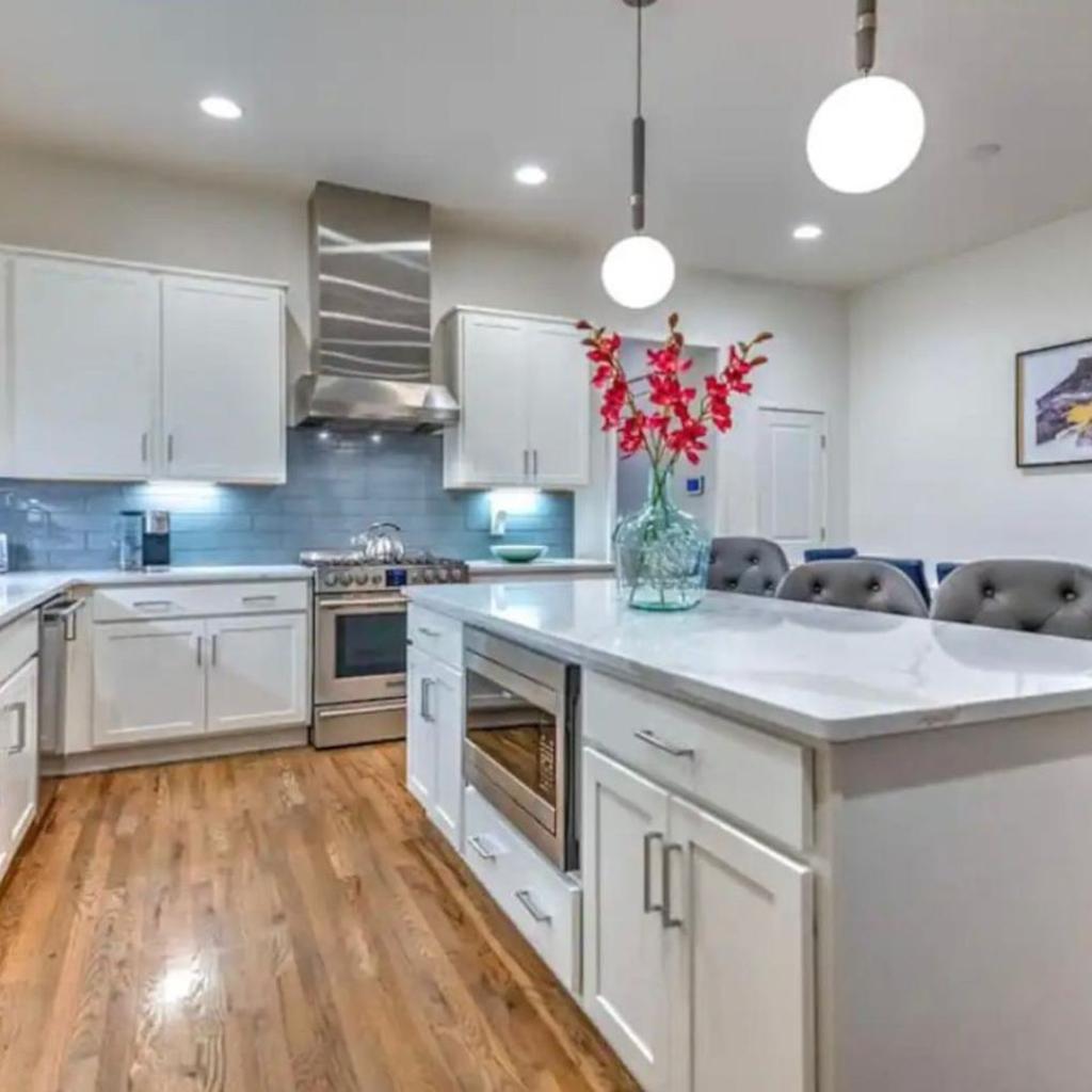 Photograph of New 4BDRM House with City views, Pool Table, 5min to Downtown! Sleeps 22!