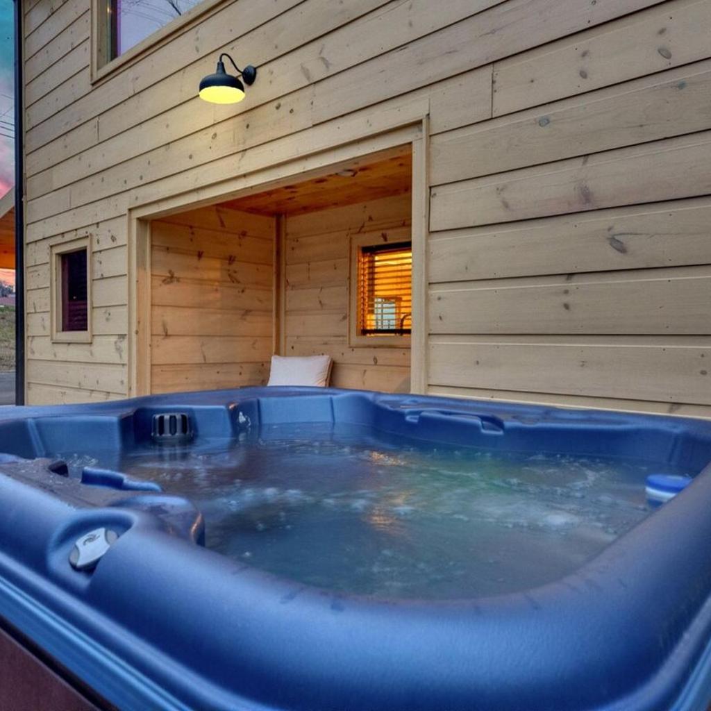 Photograph of Honeybear Hideaways - Luxury Cozy Cabin with Theater, Game Room and Hot Tub