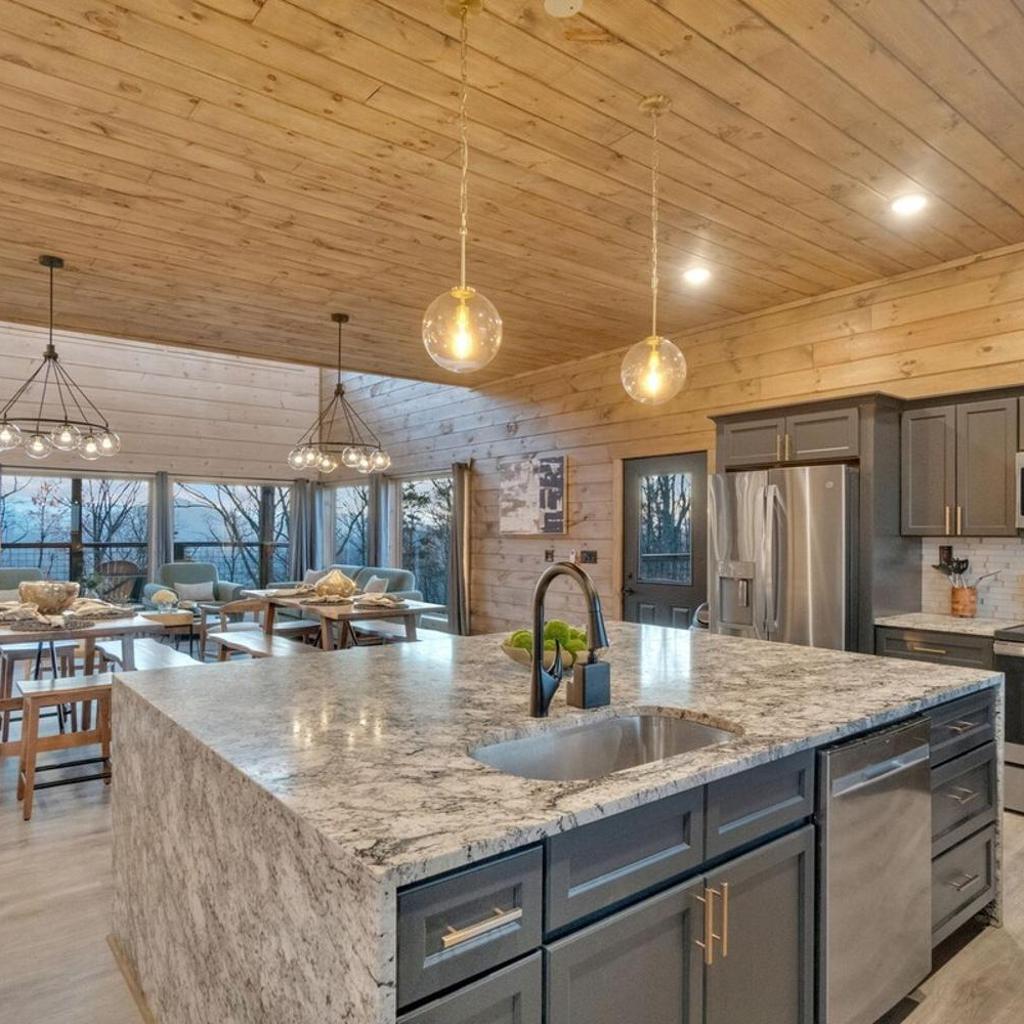 Photograph of Honeybear Hideaways - Modern Luxurious Cabin with Pool, Hot Tub, Fire Place, Game Room and Theater Room