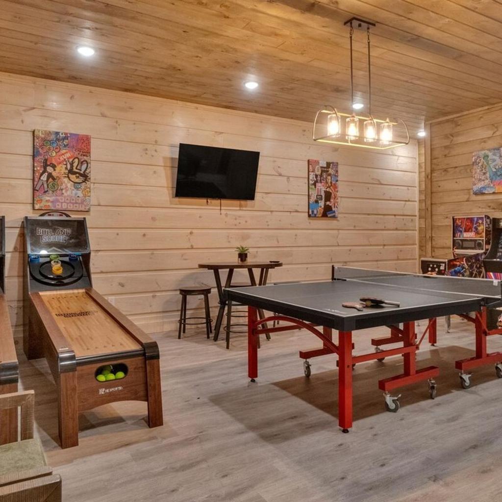 Photograph of Honeybear Hideaways - Modern Luxurious Cabin with Pool, Hot Tub, Fire Place, Game Room and Theater Room