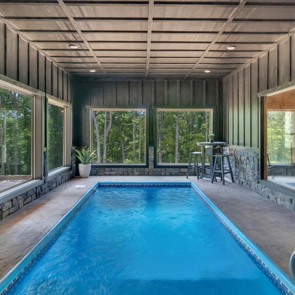 Photograph of Honeybear Hideaways - Modern Luxurious Cabin with Pool, Hot Tub, Fire Place, Game Room and Theater Room