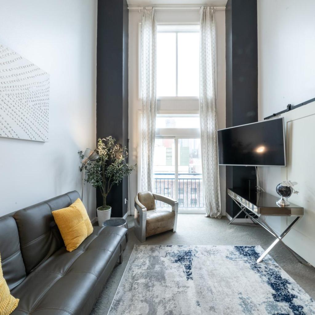 Photograph of Modern Downtown Top Floor Penthouse With Bay Views