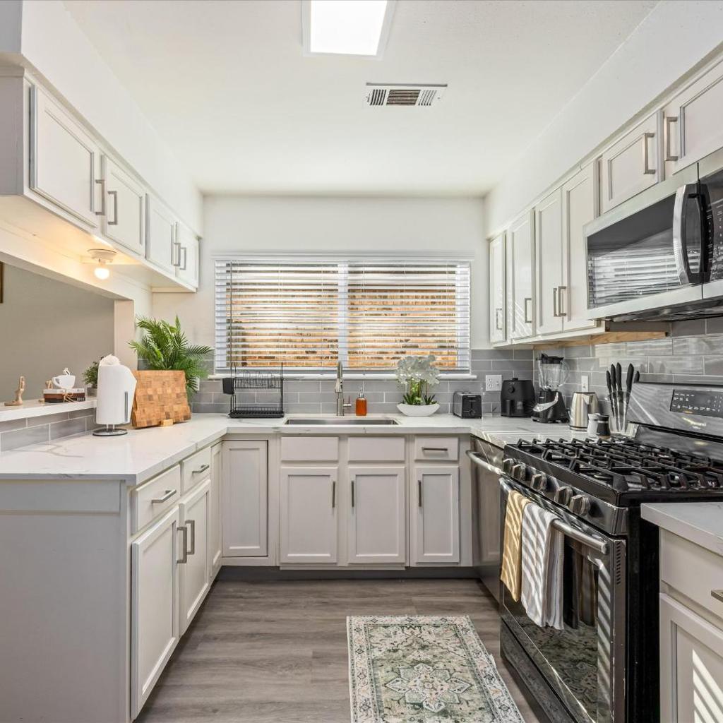 Photograph of Htown Hot Tub Getaway Swing Set BBQ Yard Games