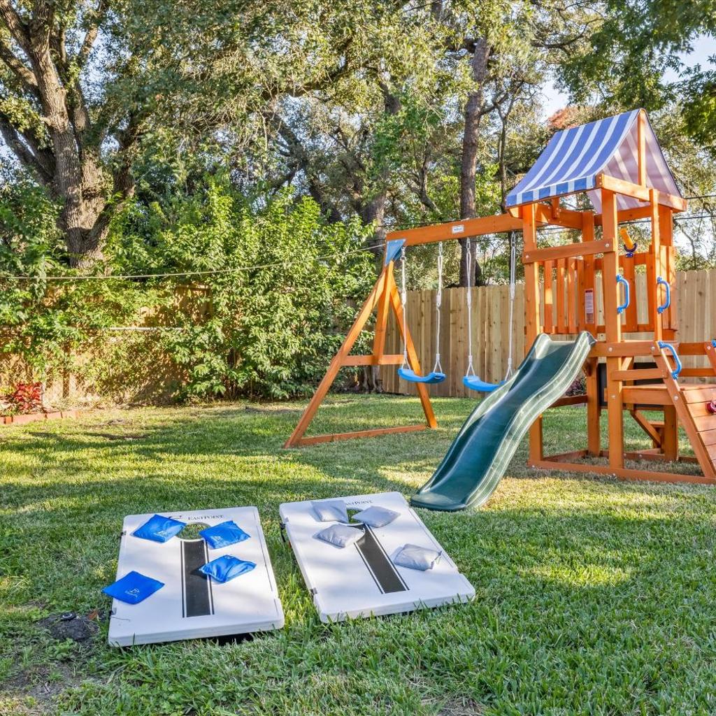 Photograph of Htown Hot Tub Getaway Swing Set BBQ Yard Games