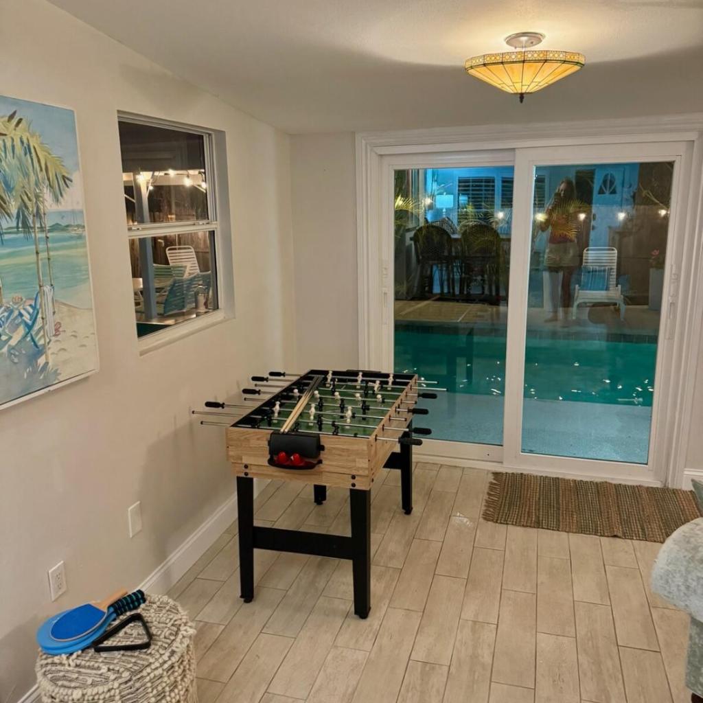 Photograph of Tropical Pool Haven Minutes to Downtown & beaches