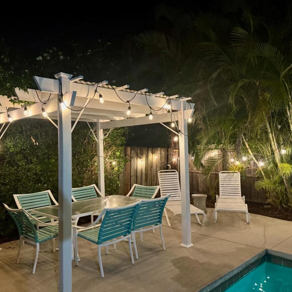 Photograph of Tropical Pool Haven Minutes to Downtown & beaches