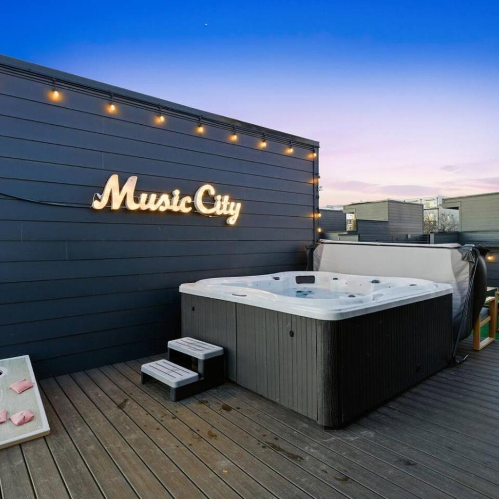 Photograph of City View Home with HotTub Rooftop Arcade Game and Parking