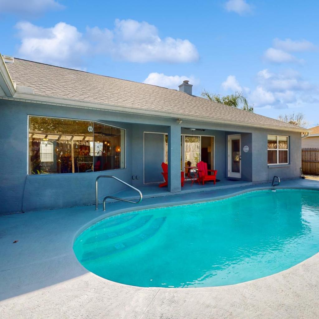 Photograph of Cheerful home with private pool close to the beach & downtown