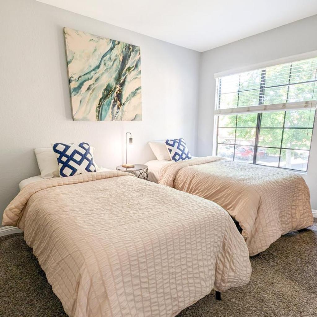 Photograph of Poolside 2BR Condo with Balcony & Workspace