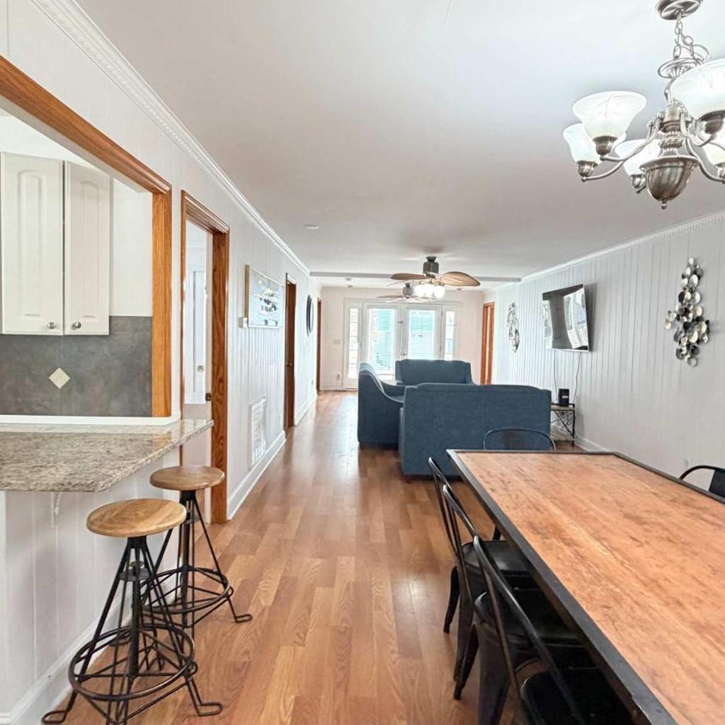 Photograph of Bright cheerful duplex with a pool A