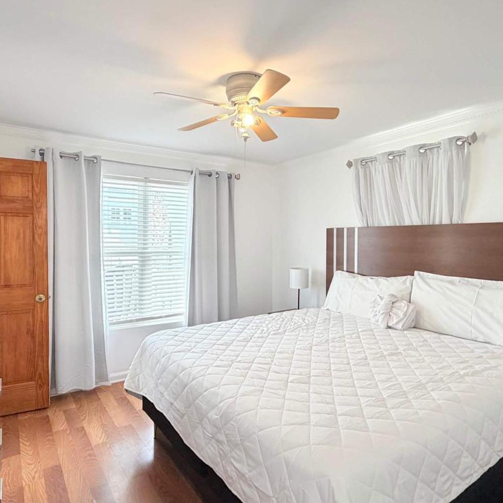 Photograph of Bright cheerful duplex with a pool A