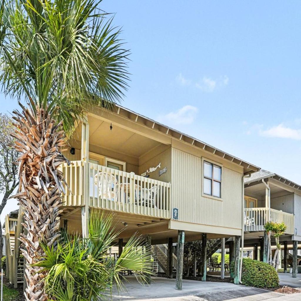 Photograph of Nostalgic Beach Cottage. Unplug near beach with pools