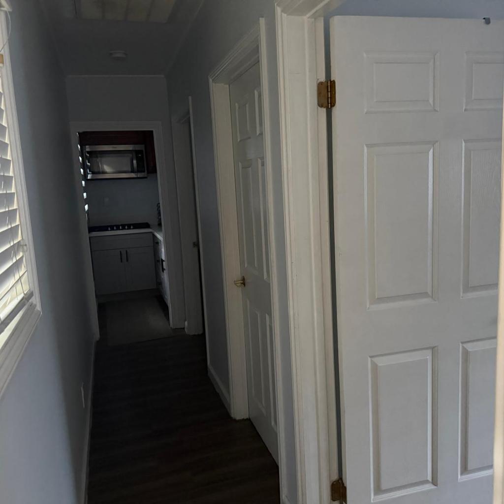 Photograph of Studio with king bed, high ceiling, and twin bed