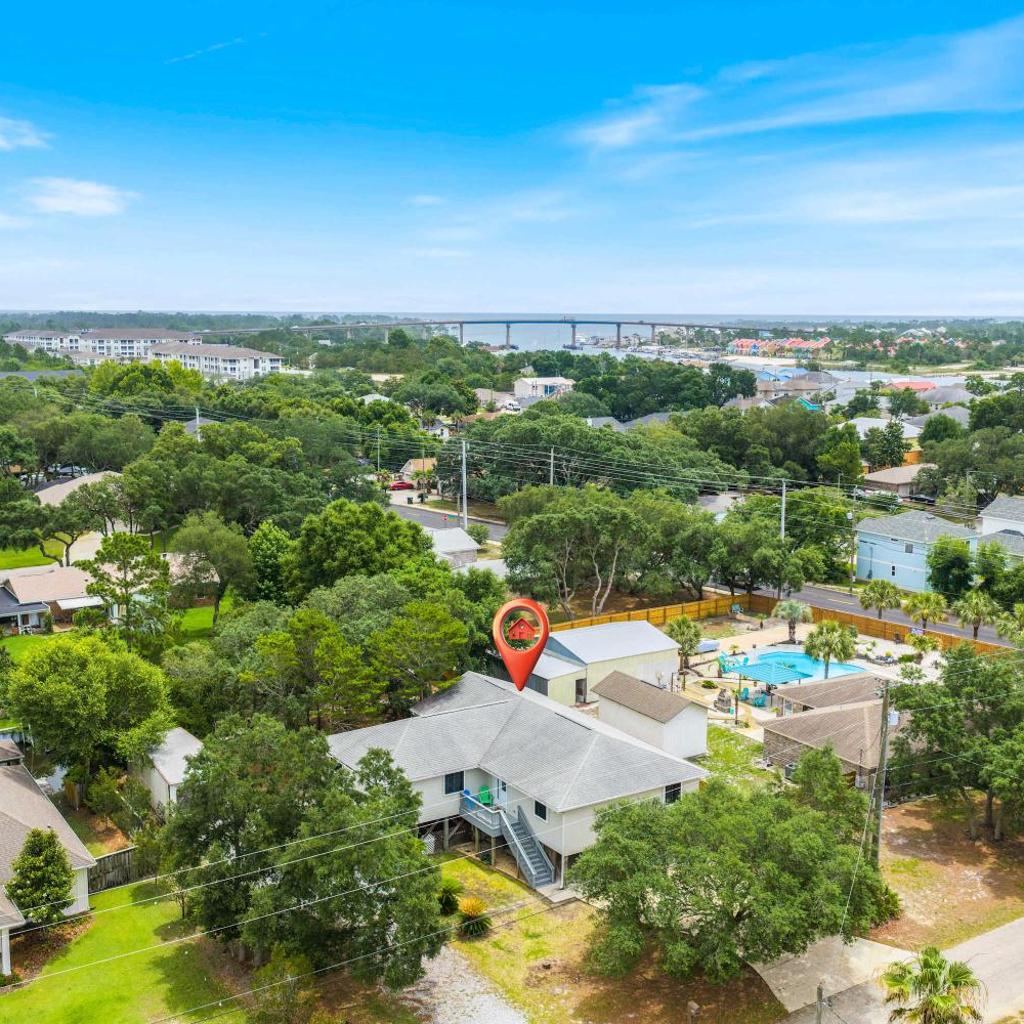 Photograph of 5BR Home Located on Canal Backyard with Deck and BBQ