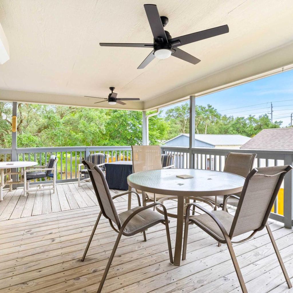 Photograph of 5BR Home Located on Canal Backyard with Deck and BBQ