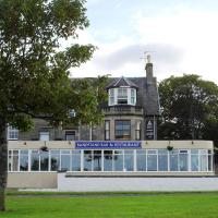a building with a sign on the front of it at The Bandstand, Nairn