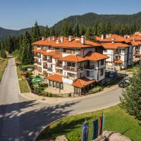 an aerial view of a large building with orange roofs at Mountain Lake Hotel, Smolyan