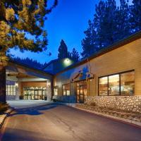 a large building with a stone wall at Empeiria High Sierra Hotel, Mammoth Lakes
