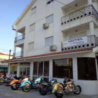 a row of motorcycles parked in front of a hotel at Hotel 4 Estacoes, Chaves