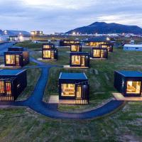a group of tiny houses in a field at Harbour View Cottages Grindavik, Grindavík