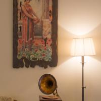 a painting hanging on a wall next to a lamp at Mirtillo Apartments, Kissos