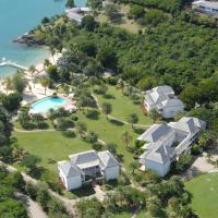 an aerial view of a villa on a tropical island at The Inn at English Harbour, English Harbour Town