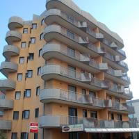 a tall building with balconies on the side of it at Campus Hotel, Bari