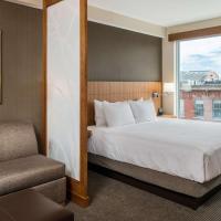 a hotel room with a bed and a window at Hyatt Place Portland-Old Port
