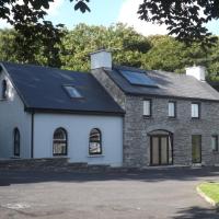 a house with solar panels on the roof at SunnySide-Cottage, Ennistymon