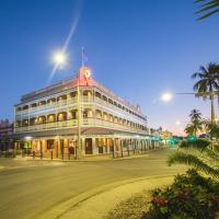 a large building on a street at night at Heritage Hotel Rockhampton