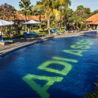 a swimming pool with the word debt in the water at Adi Assri Beach Resorts And Spa Pemuteran
