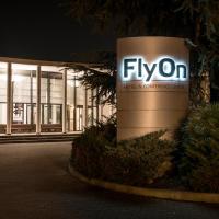 a fynon sign in front of a building at FlyOn Hotel & Conference Center, Bologna
