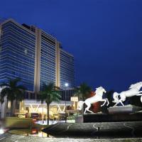 a statue of horses in front of a building at Java Palace Hotel, Cikarang