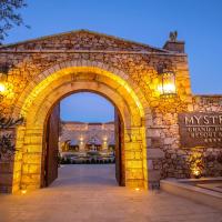 an entrance to a stone building with an arch at Mystras Grand Palace Resort & Spa