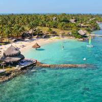 an aerial view of a beach with palm trees at Hotel Punta Faro, Isla Mucura