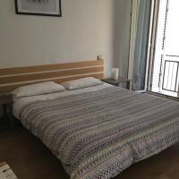 a bedroom with a bed with a blanket on it at La Casetta Due, Teramo