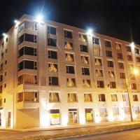 a large apartment building at night with street lights at Hotel Diego de Almagro Valparaíso