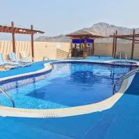 Mirage Hotel Al Aqah, отель в Аль-Аке