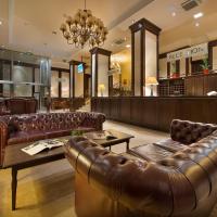 a store with a leather couch and a coffee table at Apollo Hotel Bratislava