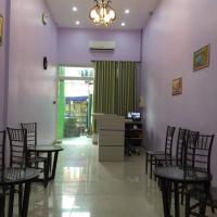 a dining room with chairs and a table and purple walls at Meaco Royal Hotel - Lipa
