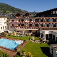 an aerial view of a hotel with a swimming pool at Hotel Neue Post, Zell am See