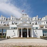 a view of the front of a white building at The Grand Hotel, Eastbourne